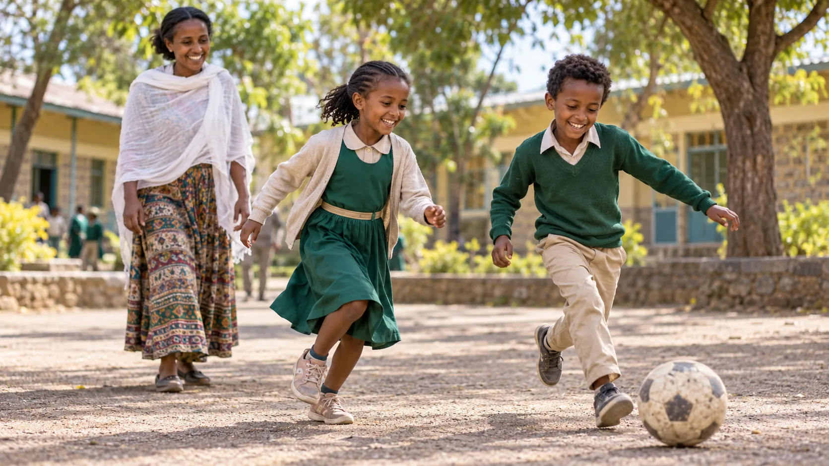 A child playing actively outdoors with a caregiver nearby